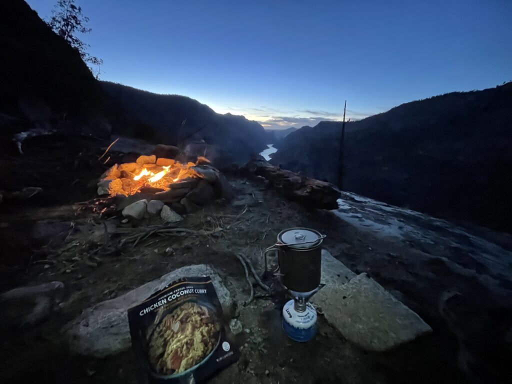 Evening campfire with mountains